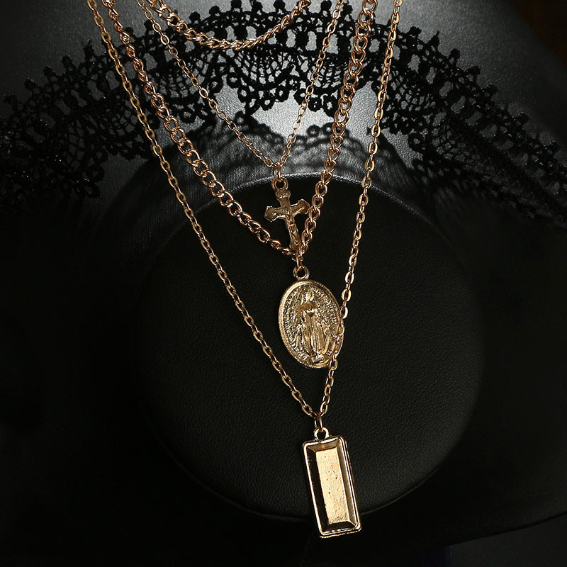 Multi-Layer Necklace with Cross and Virgin Mary Design